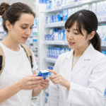 Traveler asking pharmacy staff about dry eye and contact lens eye drops in a Japanese drugstore.